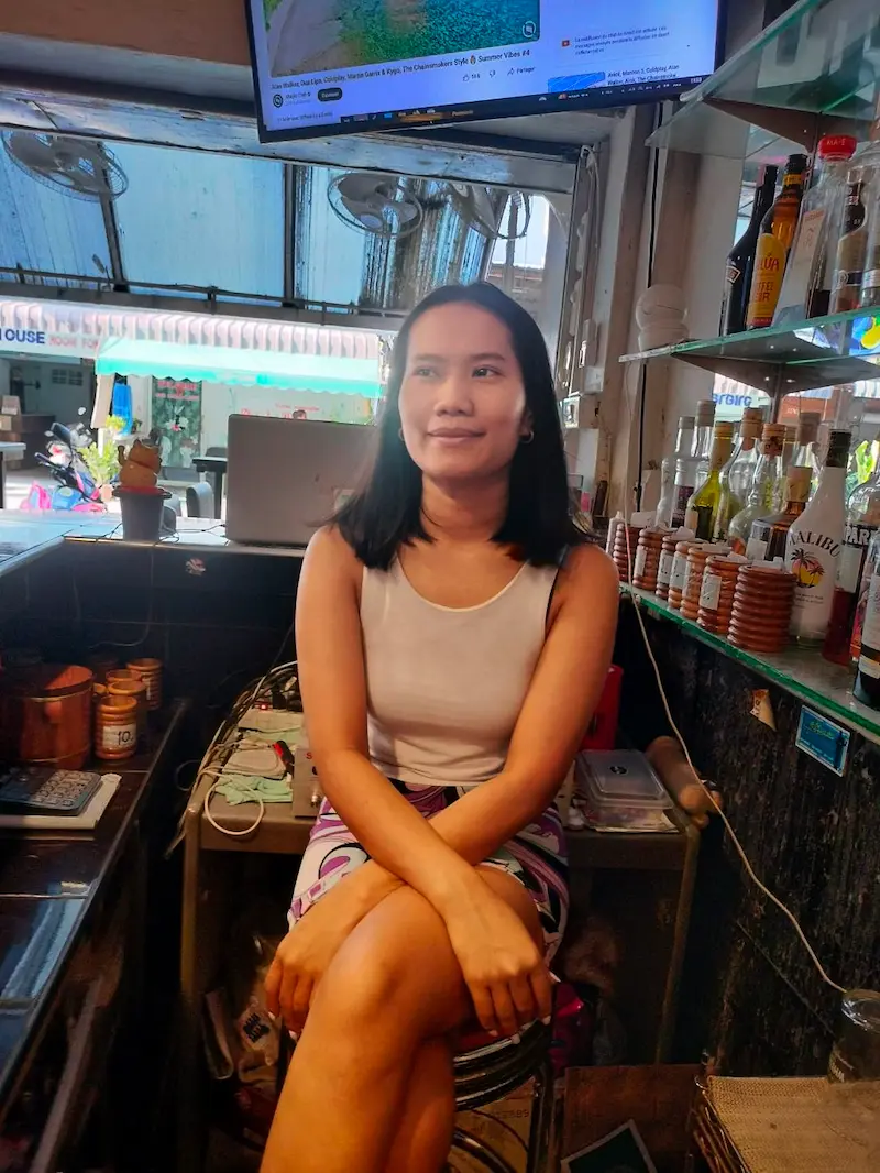 Portrait of a smiling waitress from the bar team.